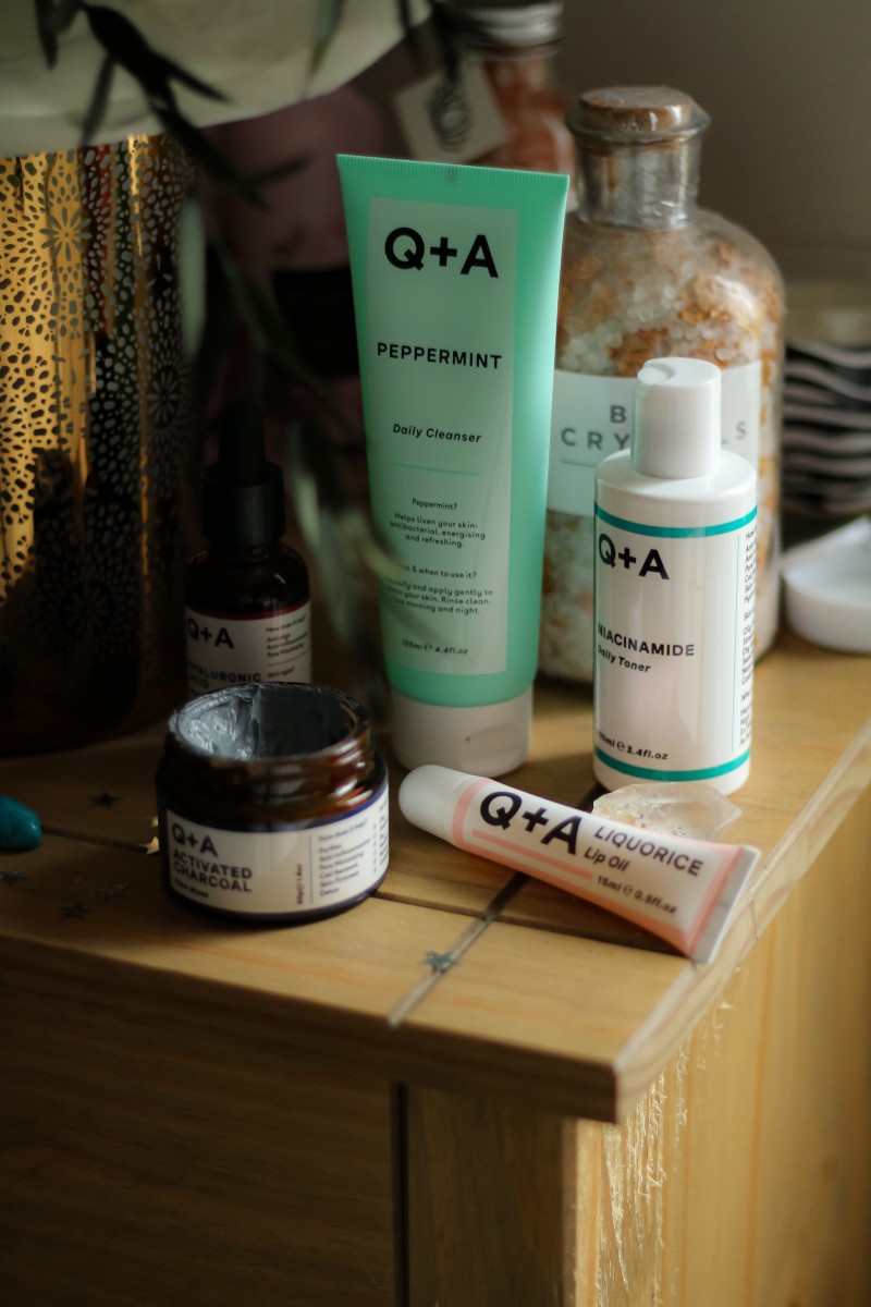 Q+A Natural Skincare products health flatlay